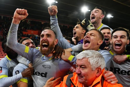 Richard Keogh enjoys Derby’s FA Cup win over Southampton with teammates in January 2019.