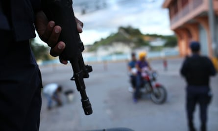 Police patrol a gang-ridden area of Tegucigalpa, the Honduran capital.