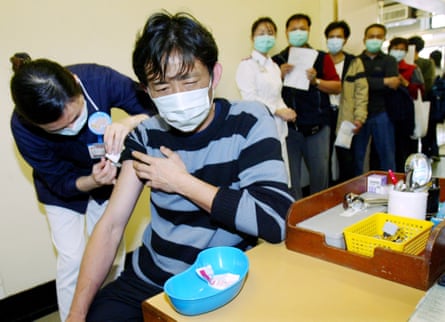 Poultry workers in Hong Kong being vaccinated during the 2004 bird flu crisis.