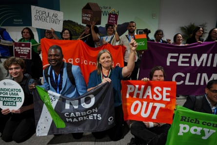 people hold signs at a protest
