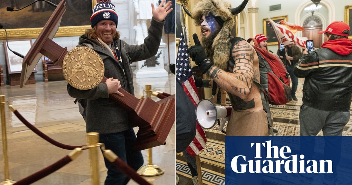 Police arrest man who carried Pelosi lectern and horned Capitol intruder
