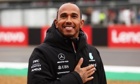 Lewis Hamilton acknowledges the crowd at Silverstone before the first practice session.