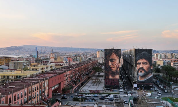 A mural of Diego Maradona, right, in Naples