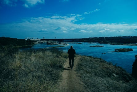 Tsegelnyk walks along a path on the island