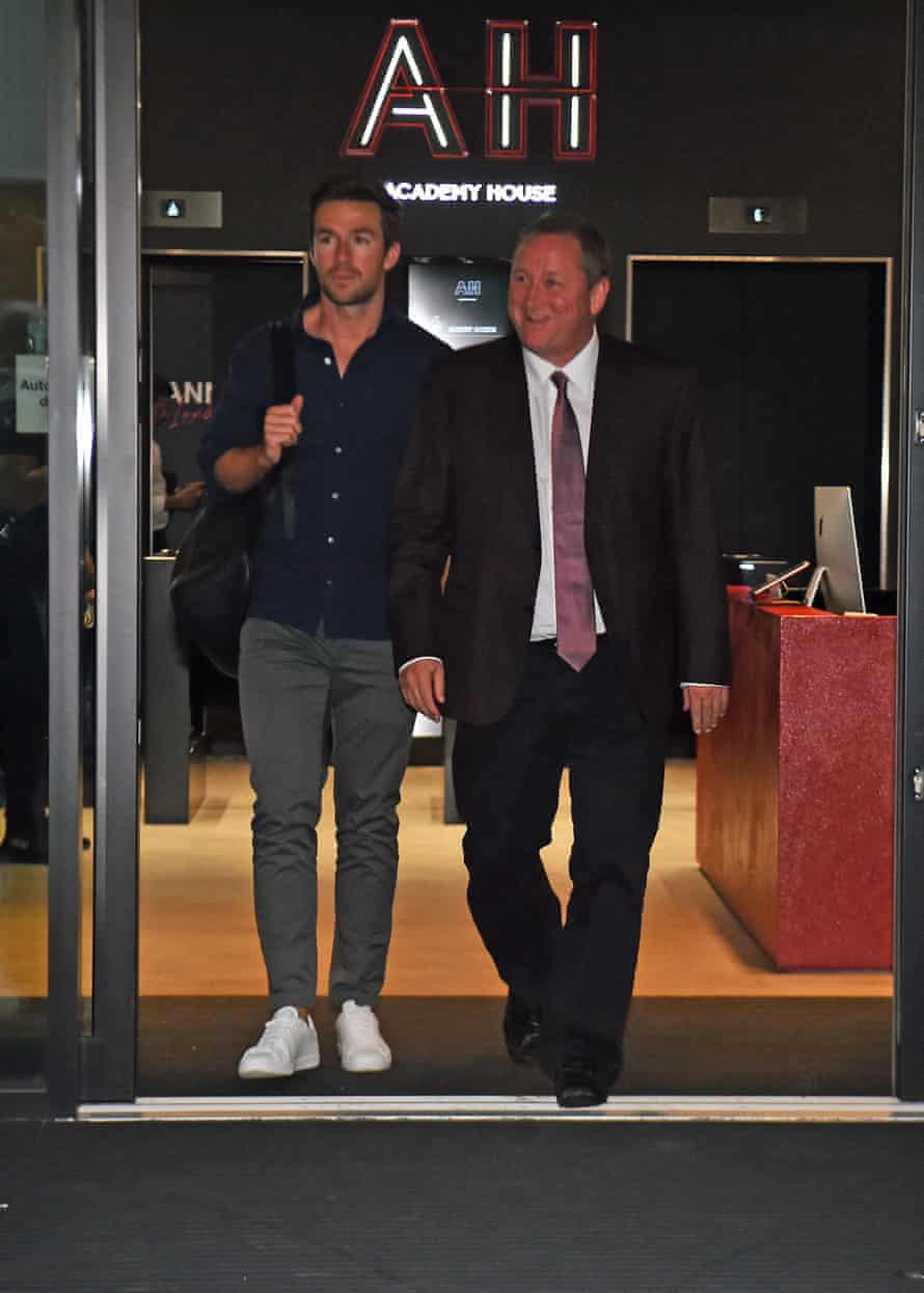 Mike Ashley leaving the Sports Direct headquarters in London with Michael Murray in 2019.