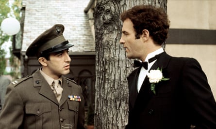 Caan, in black tie, talks to Pacino, in military uniform, in a scene from the film