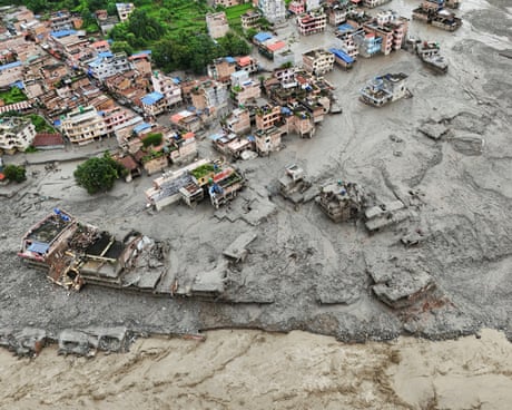 A drone view shows mud covering properties following in Trishuli.