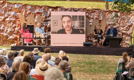 Palestinian poet Mohammed El-Kurd speaking via video link.