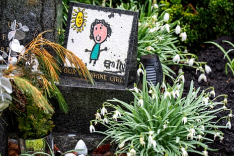 Floral tributes at the graves of victims at Dunblane cemetary.