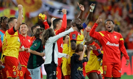 Lens players celebrate after their win over Rennes.