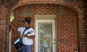 USPS employee Brandis Neal delivers mail in Houston.