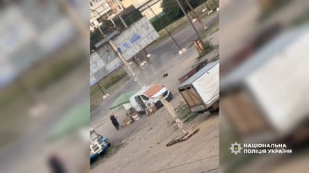 A picture released by Ukrainian’s national police shows a man selling vegetables being chased by a drone moments before it detonated, leaving him wounded and traumatised.