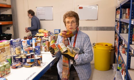 Volunteers at the food bank in Canterbury sort though donations.