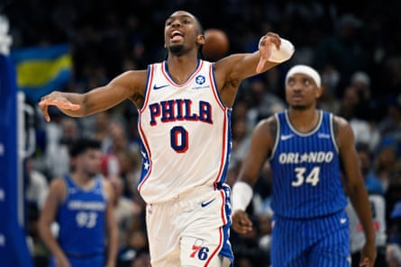 Tyrese Maxey,Wendell Carter Jr.Philadelphia 76ers guard Tyrese Maxey (0) celebrates after scoring a 3-point basket as Orlando Magic center Wendell Carter Jr. (34) looks on during the second half of an NBA basketball game, Friday, Jan. 9, 2026, in Orlando, Fla. (AP Photo/Phelan M. Ebenhack)