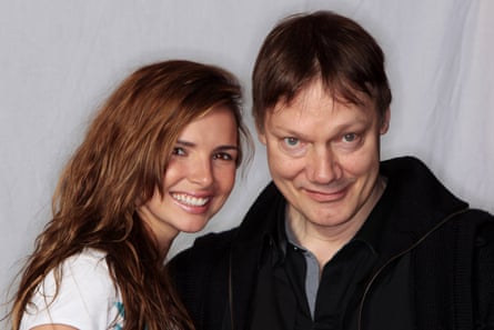 With the former Girls Aloud singer Nadine Coyle in 2010. He co-produced her debut album.