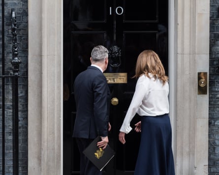 British Prime Minister Keir Starmer and his wife Victoria outside 10 Downing Street.