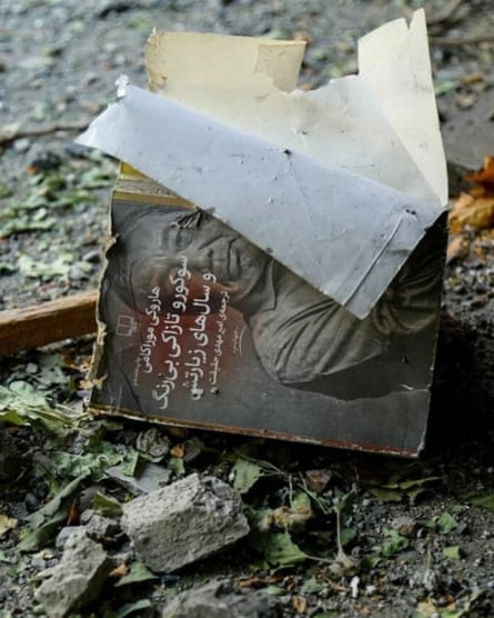 A singed book among rubble