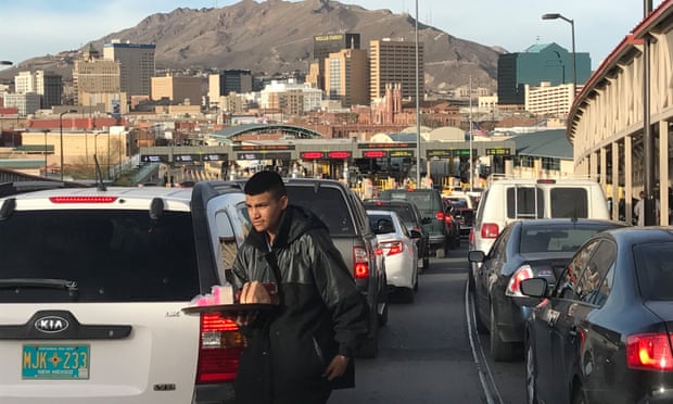 Street vendor serves traffic on the Puente de las Americas as drivers from Juarez wait to cross the border and enter El Paso