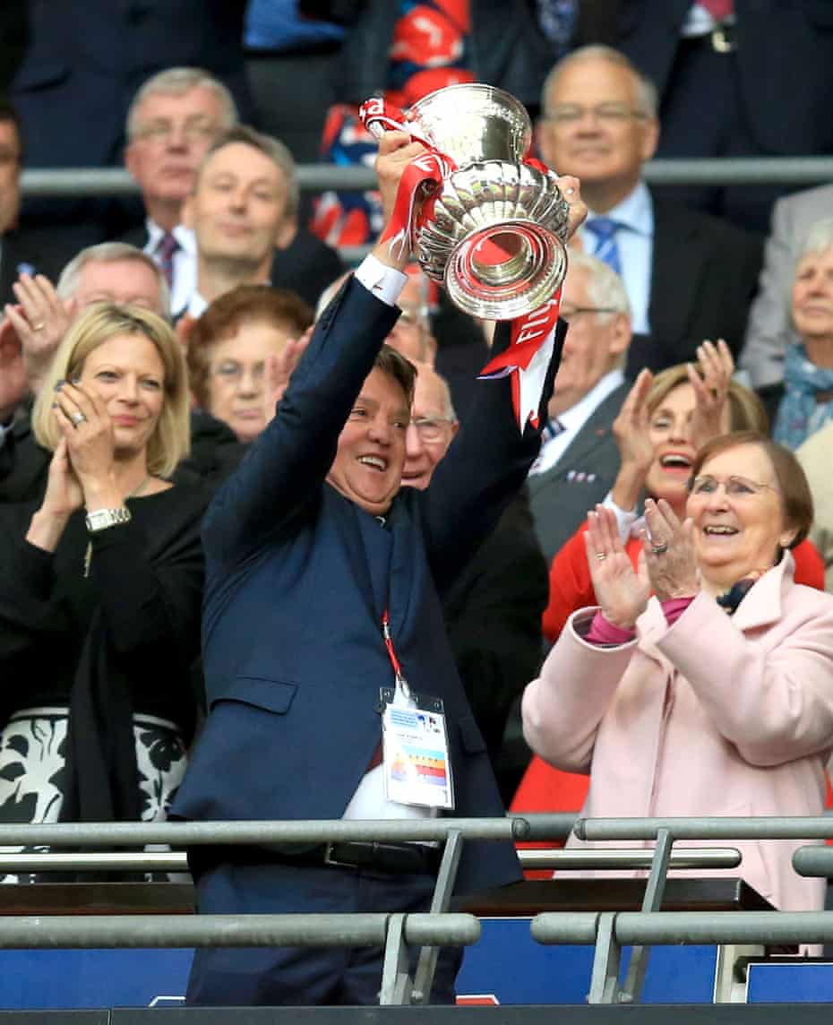 Manchester United manager Louis van Gaal lifts the FA Cup.
