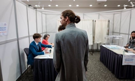 People stand in a line to vote