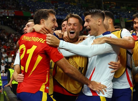 Alex Remiro (middle) is in the centre of the celebrations as Mikel Oyarzabal (left) celebrates Spain’s winner in the Euro 2024 final
