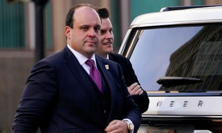 Two Washington DC men walk and look thoughtful.