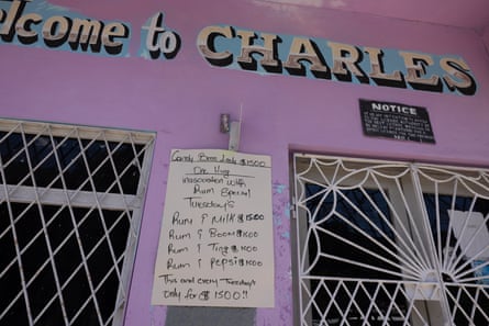 a sign on the outside wall of a bar