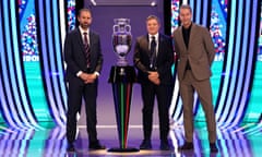 England’s Gareth Southgate, Serbia’s Dragan Stojkovic and Denmark’s Kasper Hjulmand pose with the trophy after their teams were drawn in Group C with Slovenia.