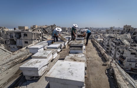 Al-Dabba works with his sons on a rooftop