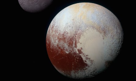 Enhanced colour image of Pluto (showing part of the moon Charon, top), taken by Nasa’s New Horizons craft on 14 July 2015.