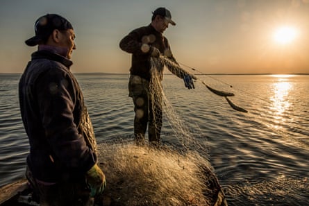 At dawn, off the coast of the village of Tastubek, fishermen pull up the nets they set the night before.