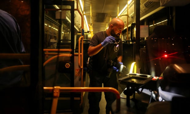 Israeli investigators inspect the bus after the shooting
