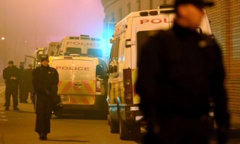Riot police outside HMP Birmingham during a disturbance.