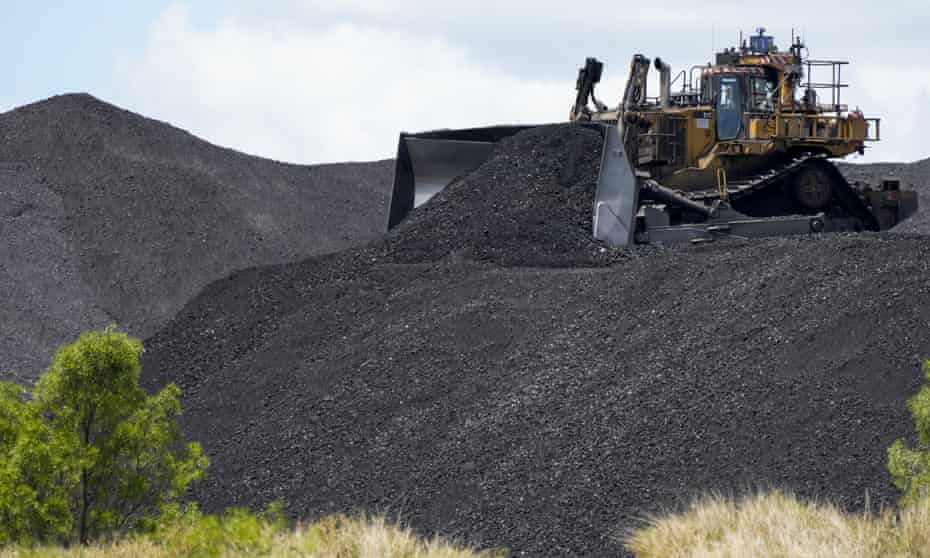 Heavy machinery moves coal at a mine in NSW