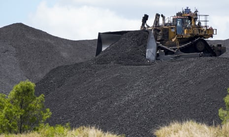 Heavy machinery moves coal at a mine 