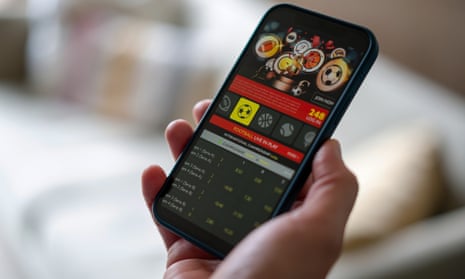 A phone screen showing a football gambling website.