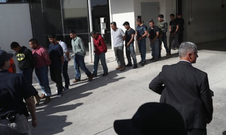 Undocumented immigrants leave a US federal court in shackles last week in McAllen, Texas.
