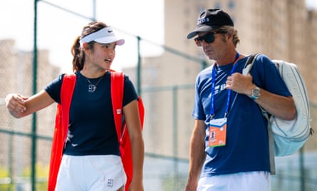 Emma Raducanu talks to her coach Francisco Roig after practice during the China Open in September