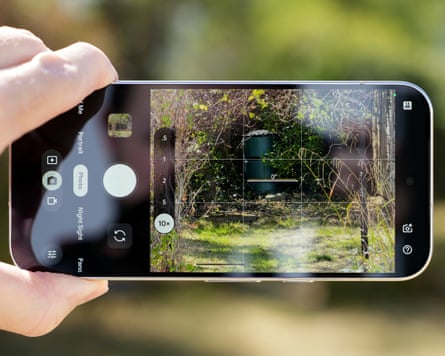 The camera app taking a photo of a garden scene on a Google Pixel 11 Pro.