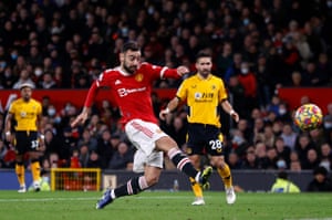 Manchester United’s Bruno Fernandes shoots at goal but hits the bar.