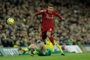 Liverpool’s Roberto Firmino goes past Norwich City’s Todd Cantwell.