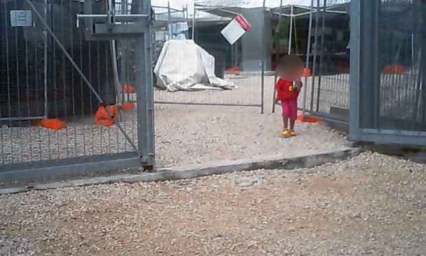 A young girl walks through the gates of the Nauru detention centre. 