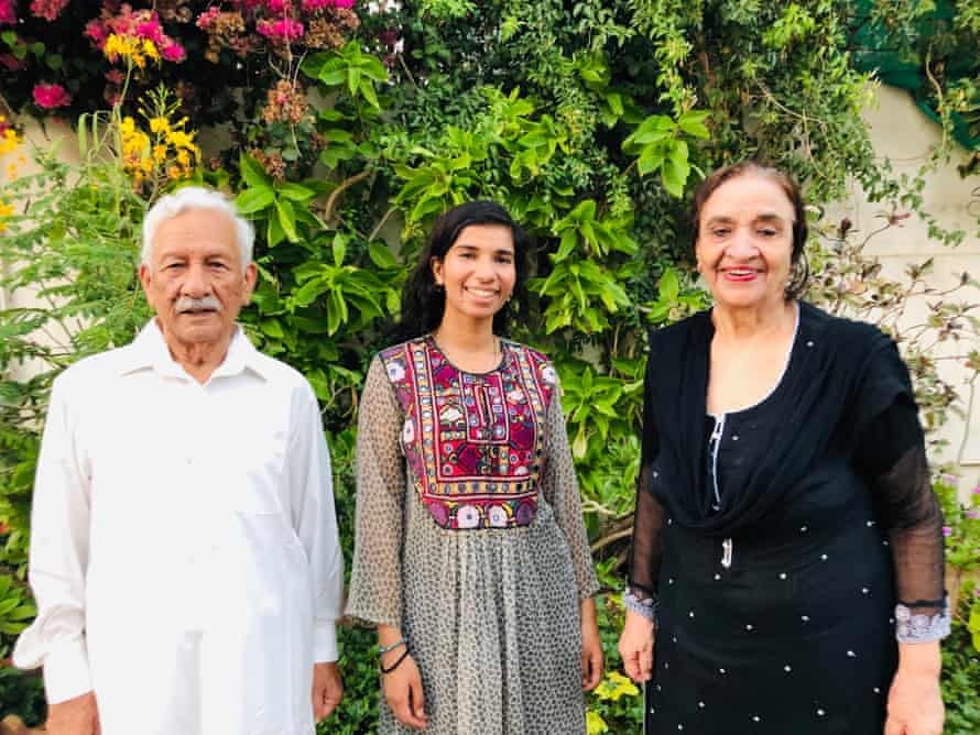Nabihah Iqbal with her grandfather and grandmother at their home in Karachi, Pakistan