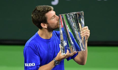 Cameron Norrie of Great Britain kisses the winner's trophy after victory over Nikoloz Basilashvili in the final at Indian Wells