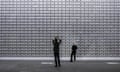 Visitors inspect a display at Art Basel in Switzerland