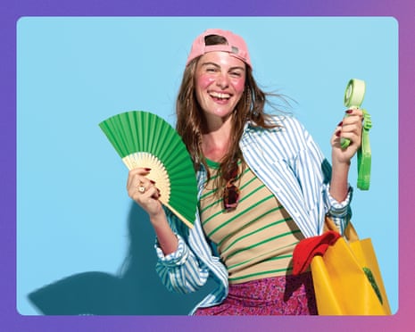 A woman wearing a pink cap holds a green fan and water bottle, carrying shopping bags and smiling