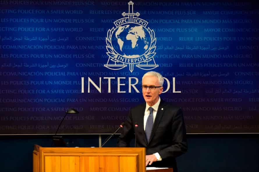 Jürgen Stock at a podium at Interpol's headquarters in Lyon