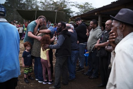 Jim Leahy, the son of Joe Leahy, is comforted by family arriving from Canada and Australia