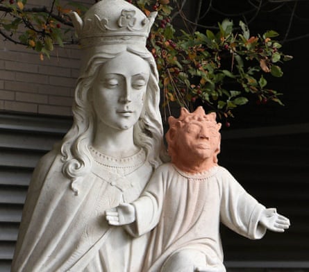 A statue stands outside Ste. Anne des Pins parish in Sudbury, Ontario