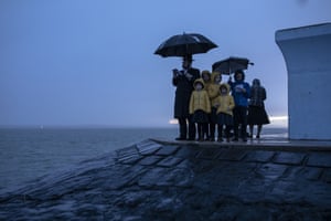 Joel Friedman and his family observe Tashlich beside the seafront at dusk in Canvey Island, Essex, UK